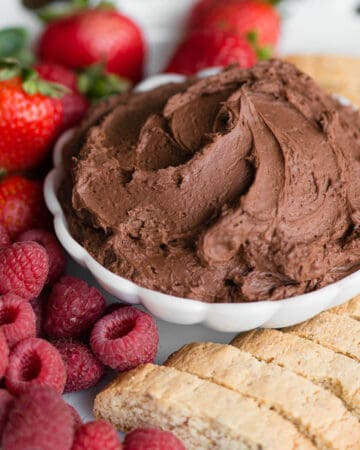 bowl chocolate cream cheese fruit dip with fruit and cookies