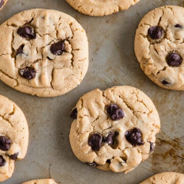 top view baking sheet with chocolate chip peanut butter cookies