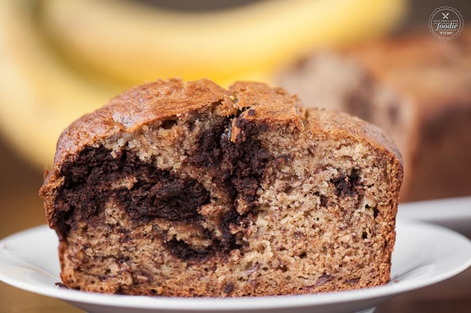 A close up of a slice of chocolate swirl banana bread
