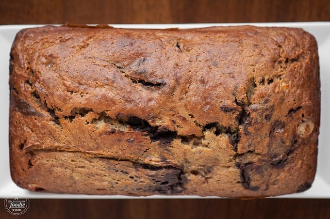 A close up of a a loaf of chocolate swirl banana bread
