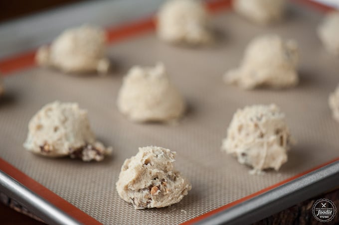 scoops of chocolate chip cookie dough on baking sheet