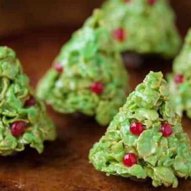 If you like Rice Krispie Treats, you'll love these holiday inspired Christmas Tree Corn Flake Treats, complete with decorations and a tootsie roll stump.