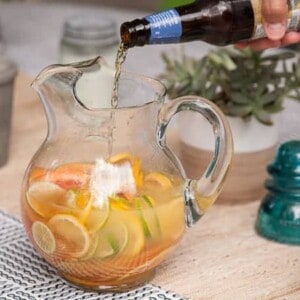 Beer cocktails are a fantastic way to incorporate beer to create tasty new adult beverages. This Citrus Beer Sangria that is sweet, bubbly, and refreshing!