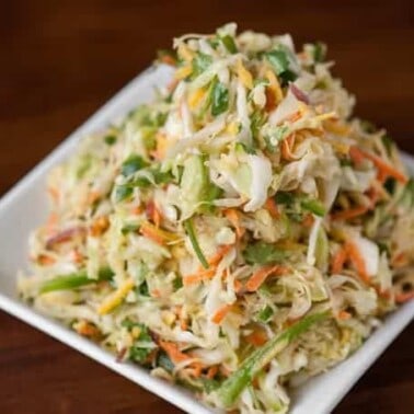 Citrus Cumin Coleslaw is a healthy and delicious side dish that is the perfect accompaniment to spicy sliders or fish tacos. Its perfect for Cinco de Mayo!