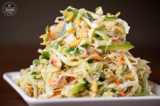 pile of homemade coleslaw with green cabbage, carrot and jalapeno