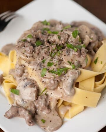This Classic Beef Stroganoff with fresh mushrooms, beef sirloin steak, and egg noodles is the ultimate comfort food a family dinner time favorite!