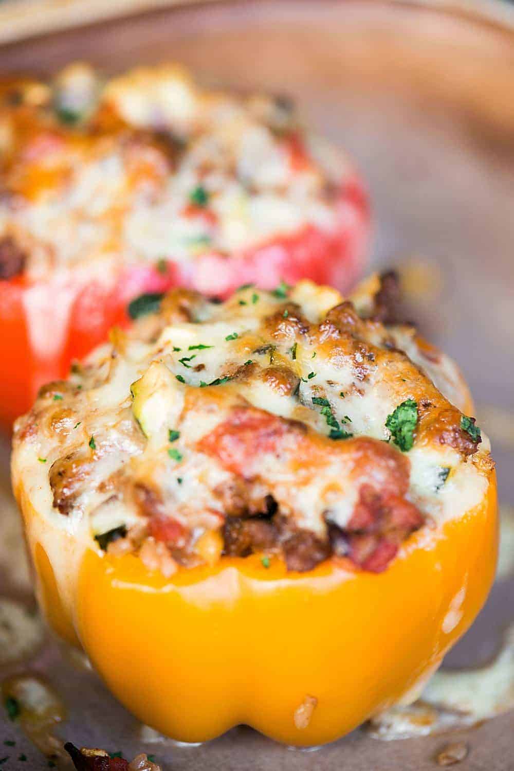 yellow stuffed pepper with melted cheese on top