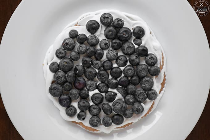 blueberries on cream and cookies for icebox cake recipe
