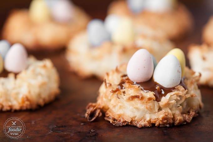 coconut cookies that look like bird nests with candy eggs on top