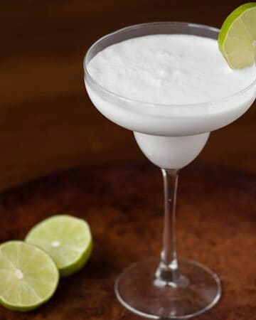 Blend up this three ingredient Coconut Lime Daiquiri. It's simple to make and in minutes you'll have a tasty, tart, & refreshing tropical cocktail.