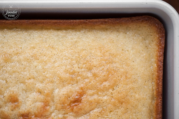 looking down at baked vanilla cake in pan