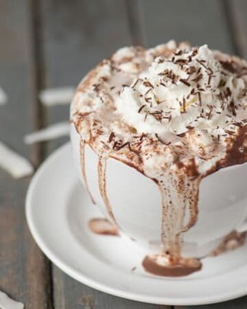 Rich and decadent Coconut Rum Hot Cocoa made from milk, half and half, chocolate, and coconut rum will warm your belly and put a smile on your face!