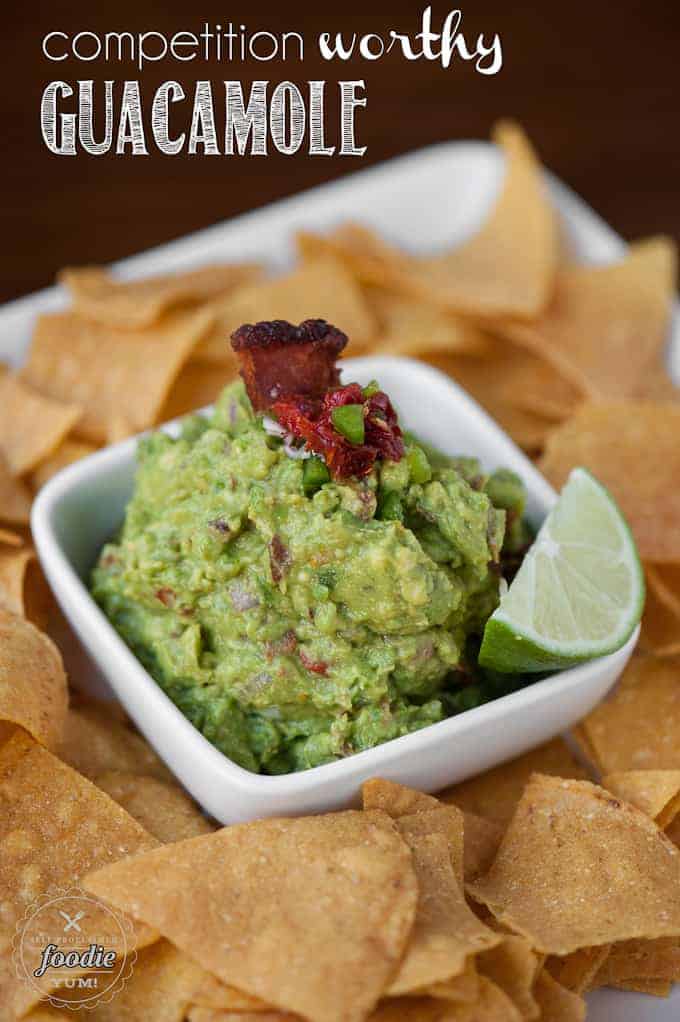 guacamole in white dish with tortilla chips