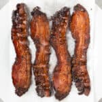four slices of oven baked bacon