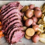 sliced corned beef and cabbage with potatoes and carrots