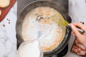 adding milk to a bacon grease roux.