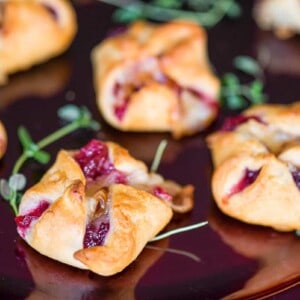 cresent roll appetizer with cranberry sauce and brie