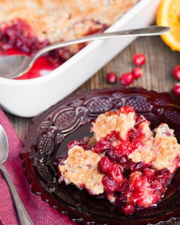 cranberry orange cobbler on red plate