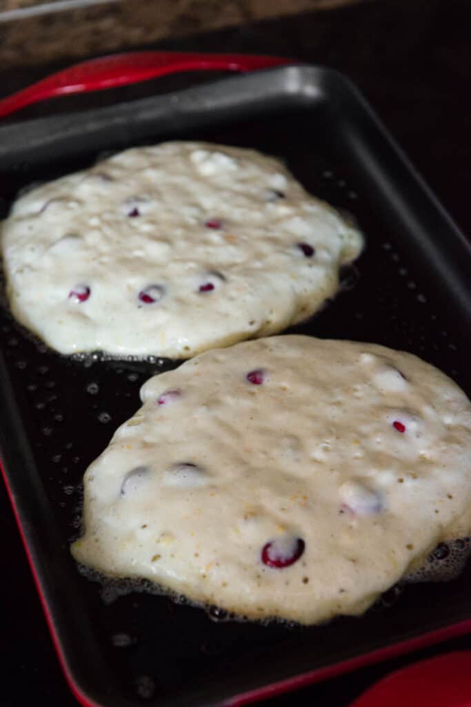 cranberry Buttermilk Pancakes on griddle