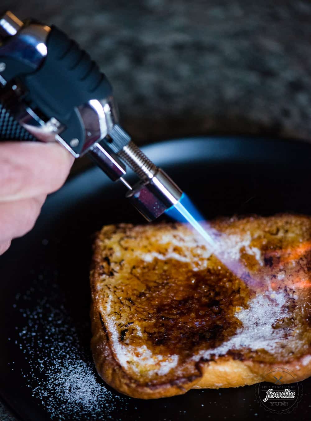 caramelizing sugar on French Toast with torch