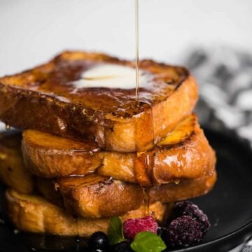 pure maply syrup pouring over stack of Crème Brûlée French Toast