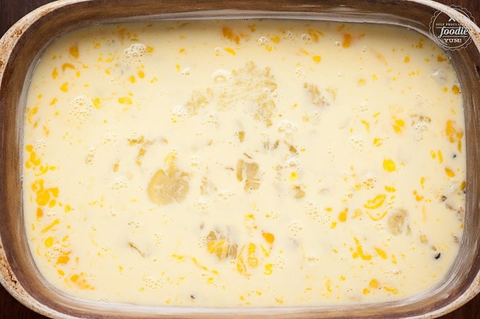 a baking dish full of uncooked egg for breakfast casserole recipe