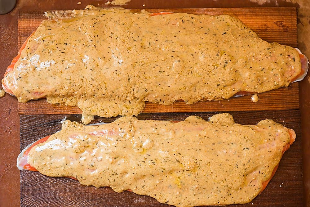 cedar plank dijon salmon covered in a sauce