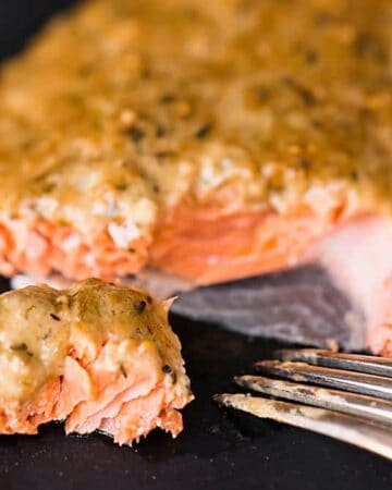 Bursting with flavor, this moist and delicious Cedar Plank Dijon Salmon made with wild caught fresh salmon might be the best thing you cook on the grill.
