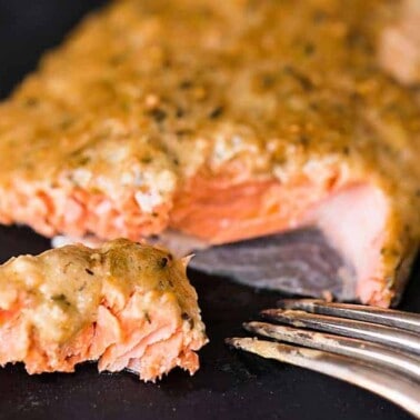 Bursting with flavor, this moist and delicious Cedar Plank Dijon Salmon made with wild caught fresh salmon might be the best thing you cook on the grill.