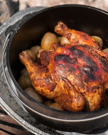 Nothing beats a good hot dog by the campfire, but sometimes a complete main course like this mouthwatering Dutch Oven Roasted Chicken just hits the spot.