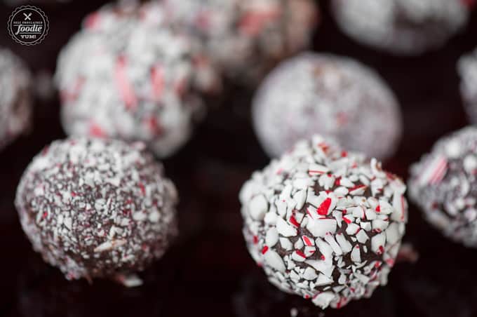 A close up of a candy cane chocolate truffle