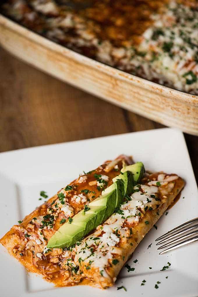 ground beef enchiladas on a white plate