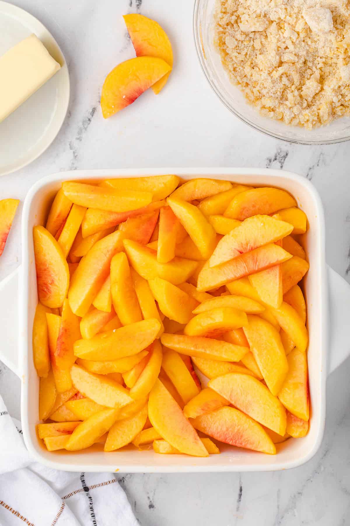 peaches in white square dish
