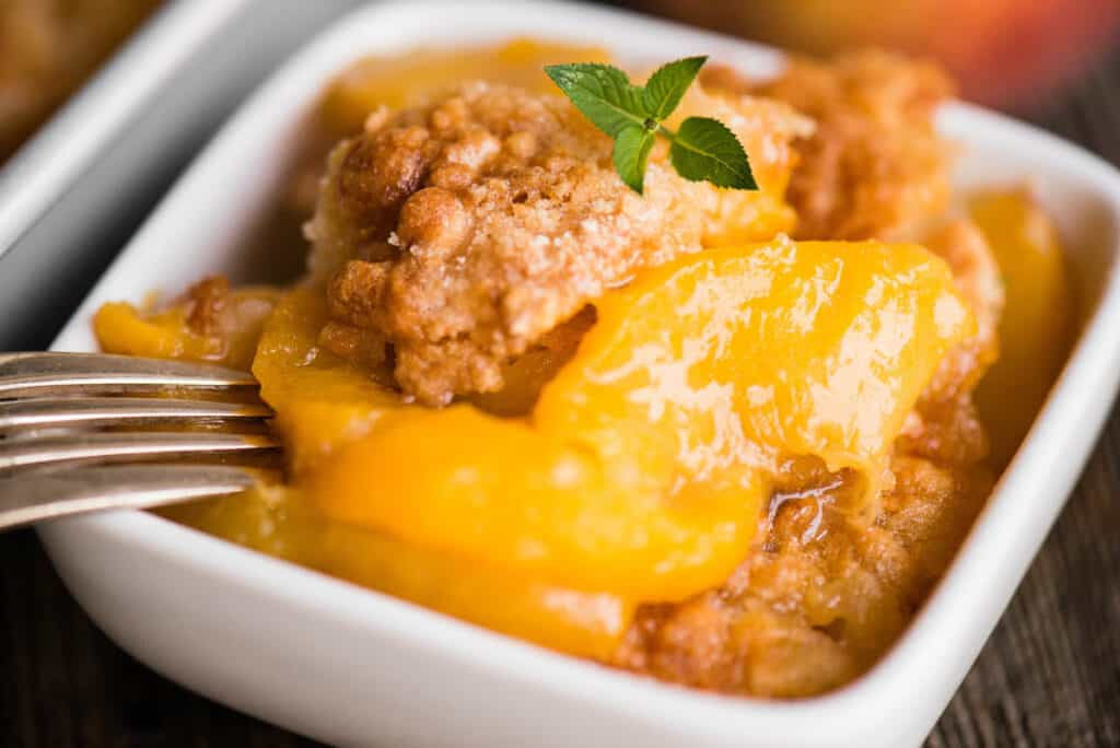 peach cobbler in dish