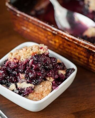 This Easy Quadruple Berry Cobbler with blueberries, blackberries, boysenberries, and blueberries is the perfect summer time dessert that everyone will love.