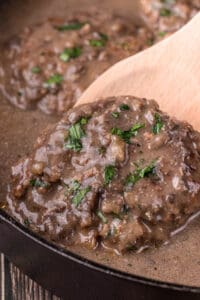 easy to make salisbury steak smothered with gravy in pan.