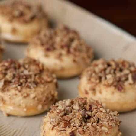 Baked Eggnog Donuts with Streusel Topping transform holiday favorites like eggnog, pecans, spiced rum, and nutmeg into a delicious breakfast treat.