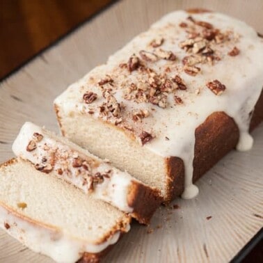 Use that leftover eggnog to make the perfect holiday treat - a rich and tasty Eggnog Poundcake complete with an eggnog glaze and crushed candied pecans.