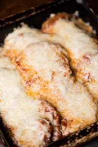 fried eggplant parm covered in cheese and sauce