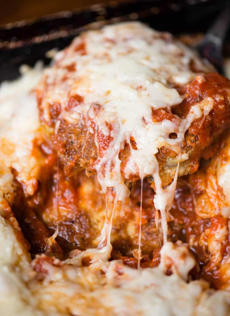 eggplant parmesan covered in sauce and melted cheese