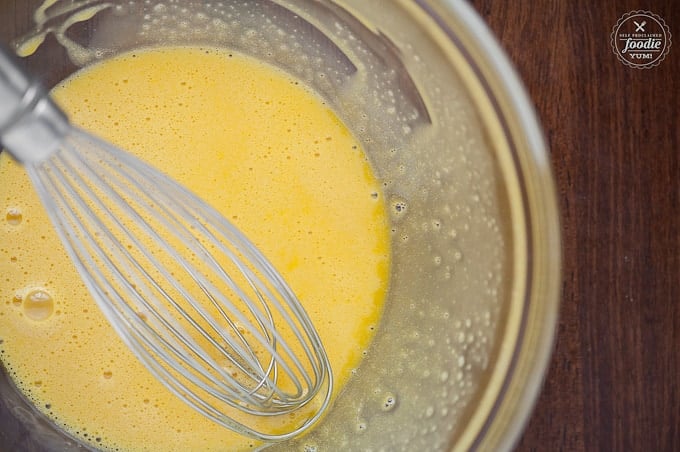 whisked egg yolks with sugar in bowl