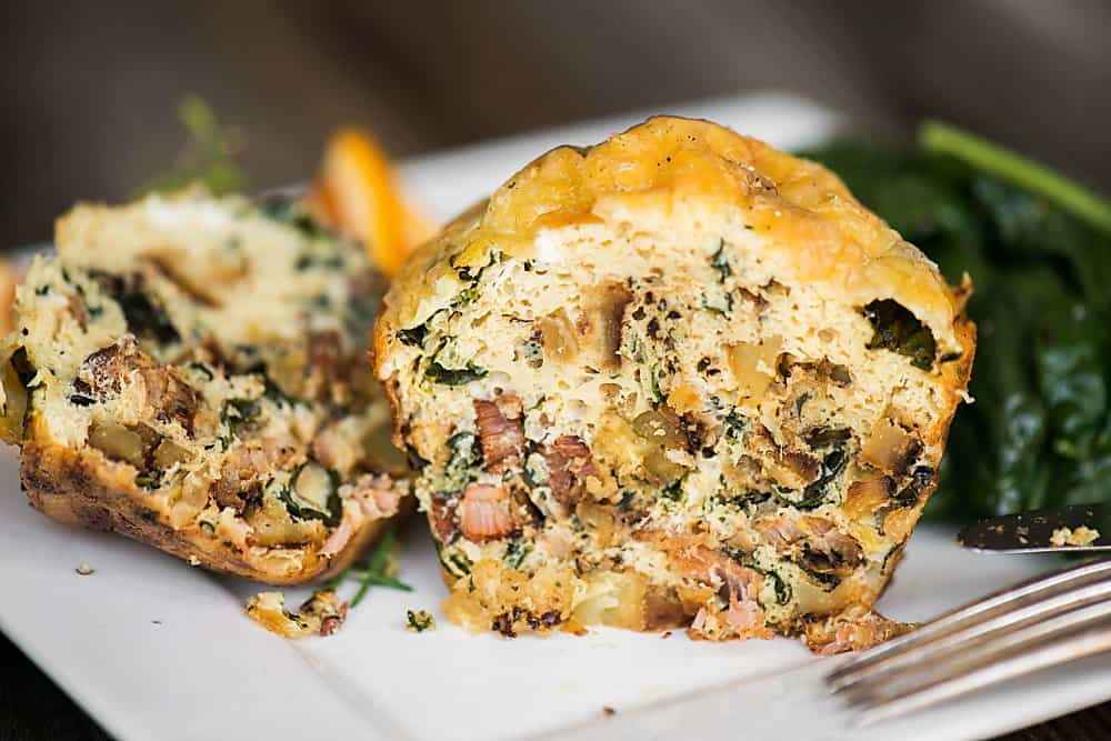 A close up of a fall harvest egg muffin cut in half