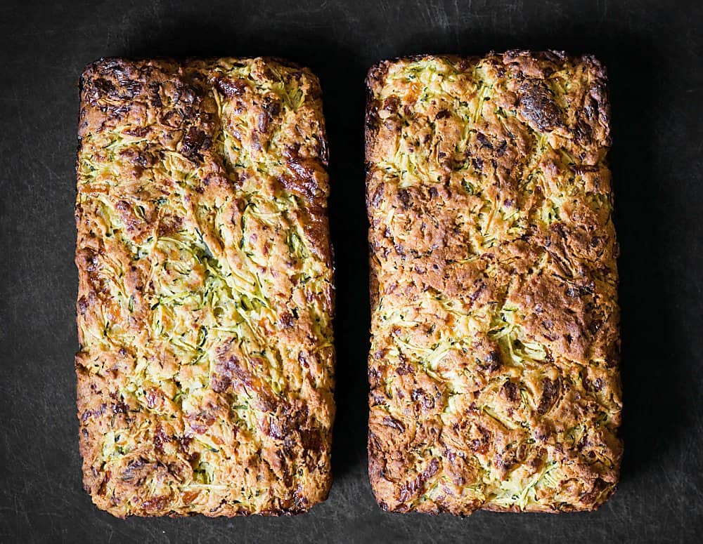 two loaves of cheddar zucchini bread with jalapeno honey butter