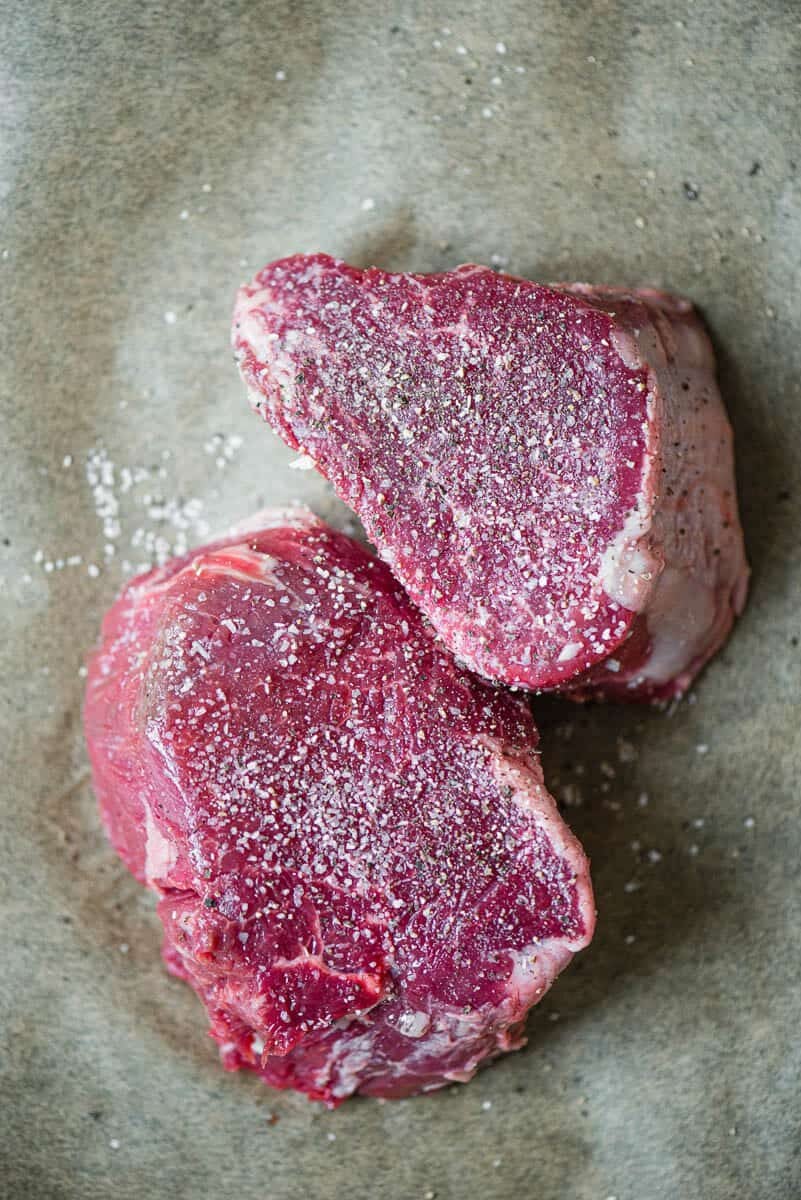 filet mignon steaks raw with salt and pepper