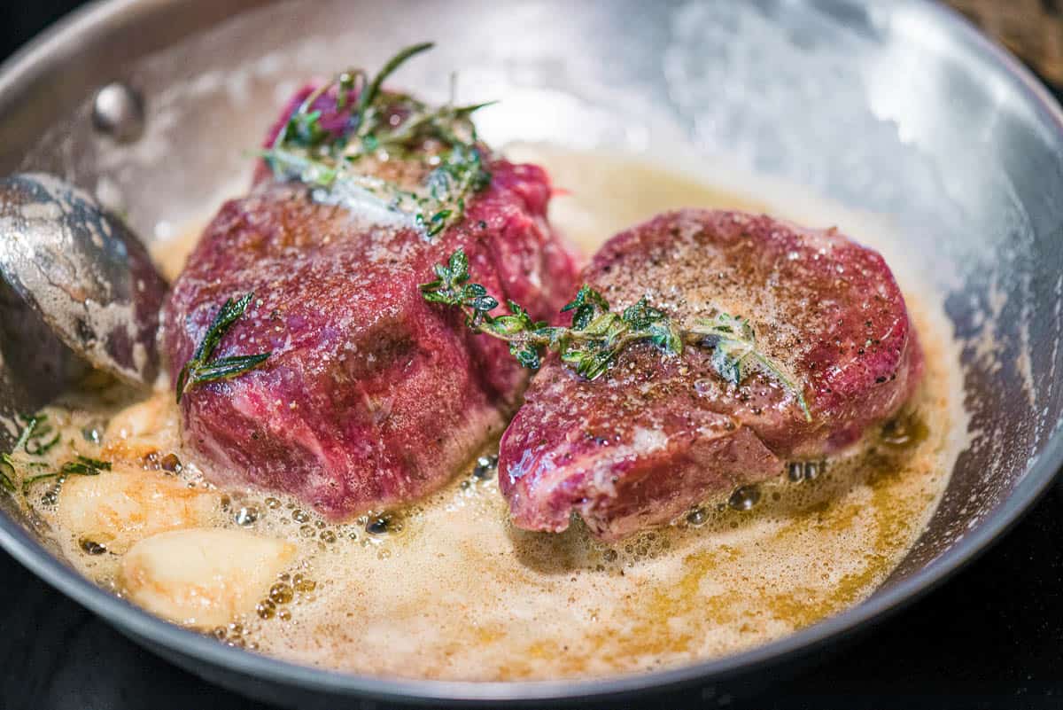 searing steaks in garlic butter