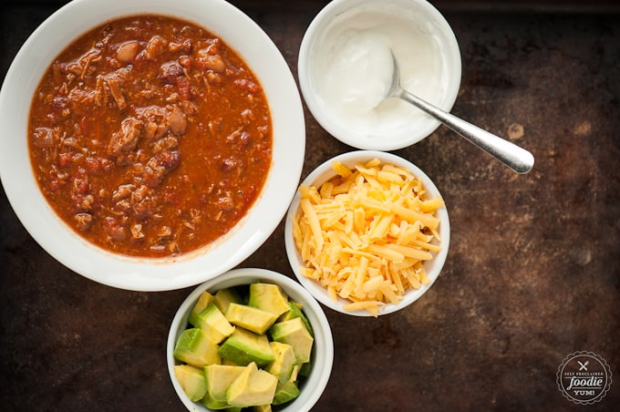 Steak Chili in bowl with toppings