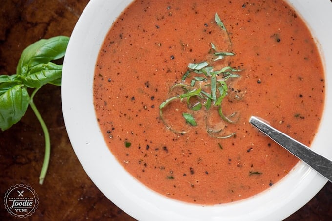 a close up photo of tomato soup in a bowl