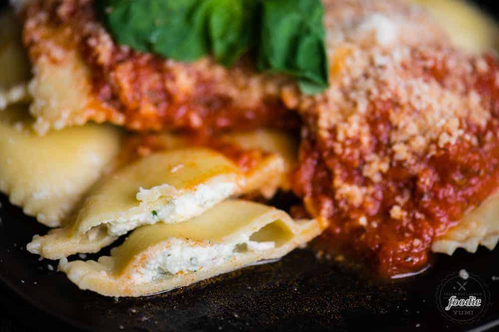 Homemade Four Cheese Ravioli on plate with sauce