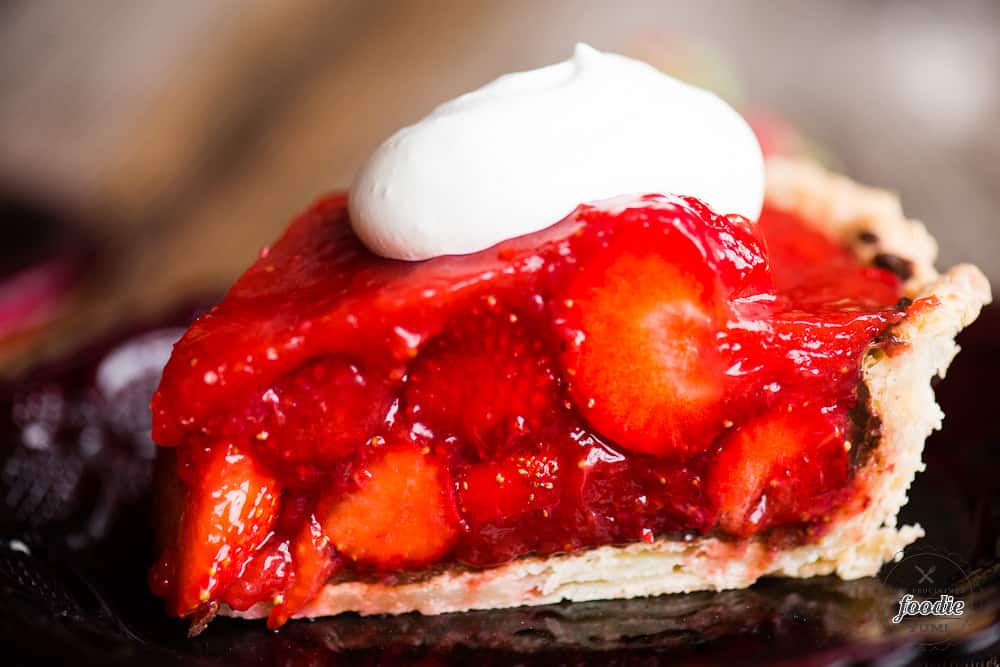 Slice of strawberry pie with chocolate layer