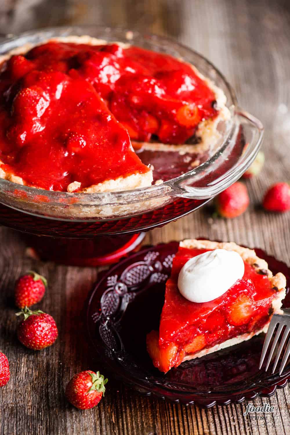 Slice of fresh strawberry pie with whipped cream